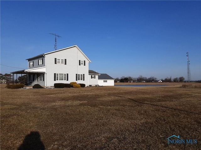 view of home's exterior with a yard