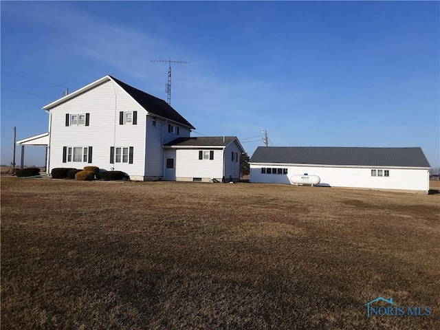 view of property exterior with a yard