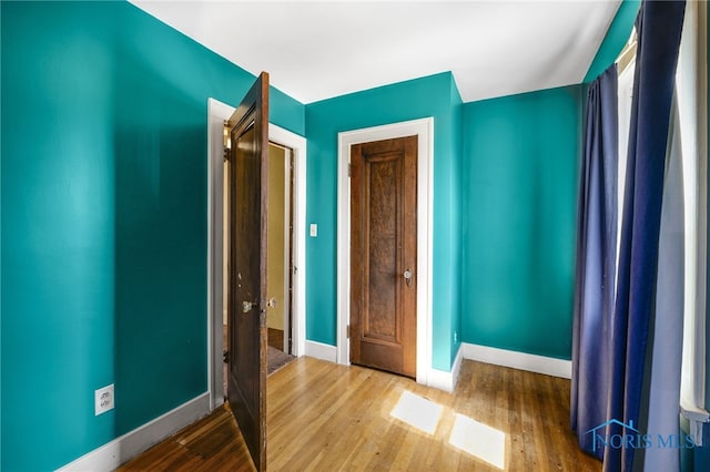 2720 106th St, Toledo, OH 43611 - unfurnished bedroom featuring baseboards and wood finished floors