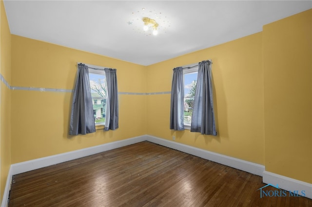 2720 106th St, Toledo, OH 43611 - empty room featuring a wealth of natural light, baseboards, and wood finished floors