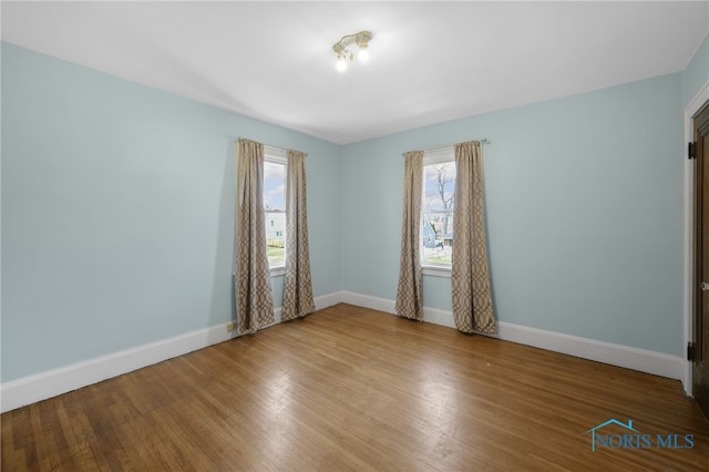 2720 106th St, Toledo, OH 43611 - empty room with wood finished floors and baseboards