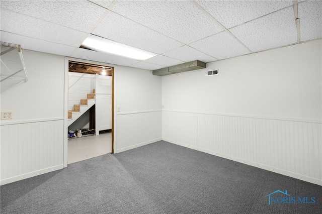 2720 106th St, Toledo, OH 43611 - finished below grade area with a drop ceiling, visible vents, a wainscoted wall, carpet floors, and stairs