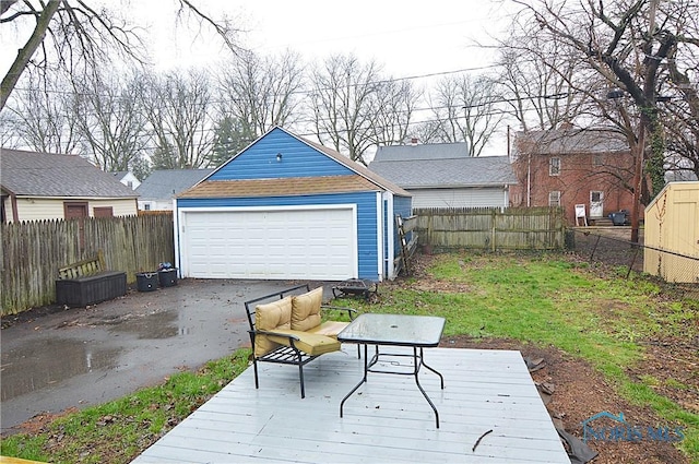 detached garage featuring fence