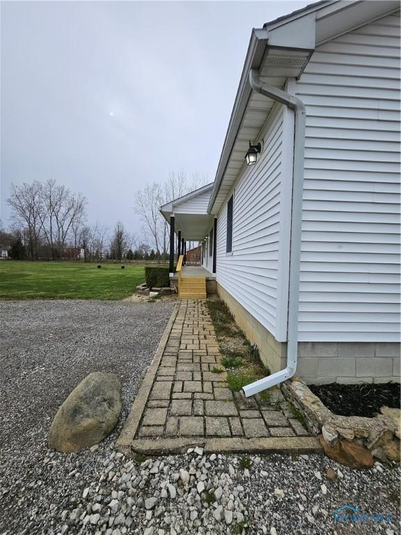 10308 Dowling Rd, Perrysburg, OH 43551 - view of home's exterior featuring a lawn