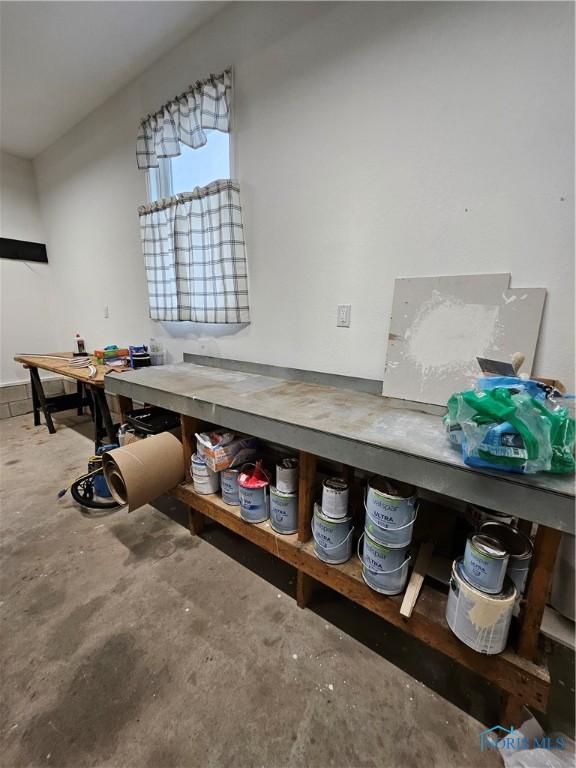 10308 Dowling Rd, Perrysburg, OH 43551 - interior space featuring unfinished concrete floors and a workshop area