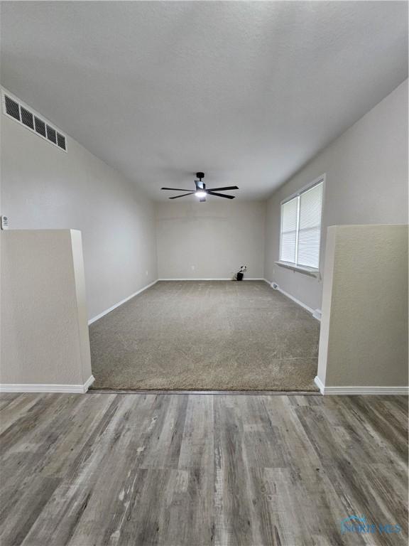 10308 Dowling Rd, Perrysburg, OH 43551 - spare room featuring a ceiling fan, baseboards, and wood finished floors
