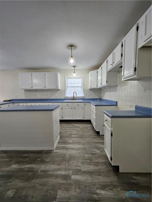 10308 Dowling Rd, Perrysburg, OH 43551 - kitchen featuring a sink, white cabinets, and backsplash