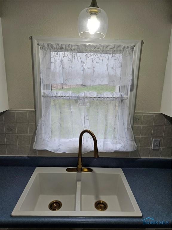 10308 Dowling Rd, Perrysburg, OH 43551 - kitchen view of a sink and dark countertops