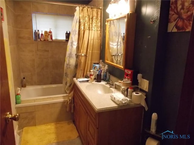 2332 Airline Ave, Toledo, OH 43609 - bathroom featuring tiled shower / bath, vanity, and tile patterned floors