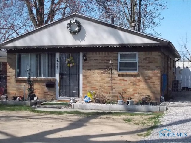 2332 Airline Ave, Toledo, OH 43609 - bungalow-style home featuring brick siding