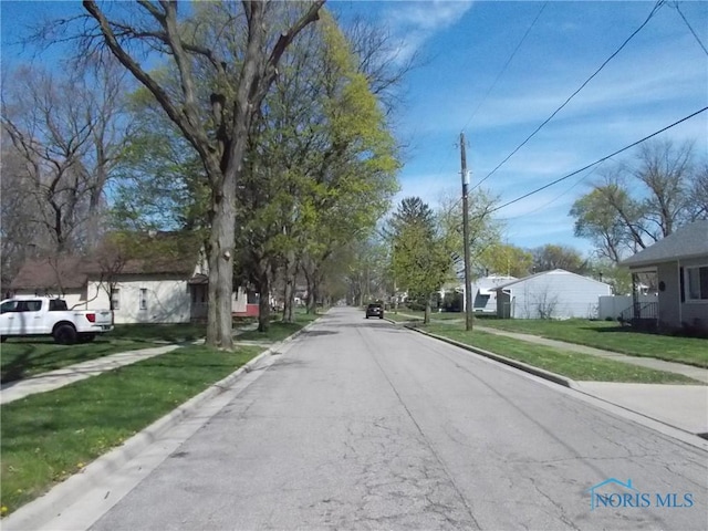 2332 Airline Ave, Toledo, OH 43609 - view of asphalt street featuring sidewalks and curbs