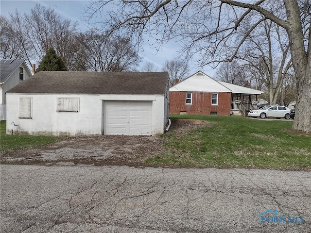 634 Cherry St, Wauseon, OH 43567 - garage with aphalt driveway