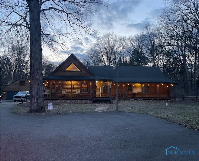 2525 N King Rd, Toledo, OH 43615 - log home featuring a porch and a garage