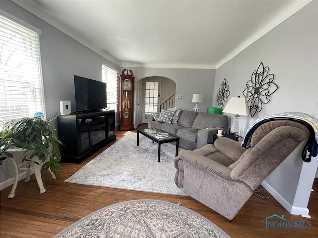 2003 Rivard Rd, Toledo, OH 43615 - living room with arched walkways, baseboards, and wood finished floors