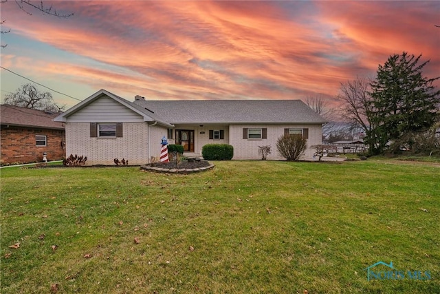 2560 Shoreland Ave, Toledo, OH 43611 - view of front of house featuring brick siding and a lawn