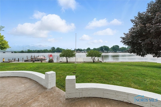 2560 Shoreland Ave, Toledo, OH 43611 - view of green lawn featuring a water view and a boat dock