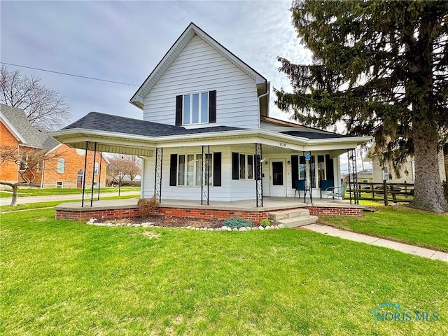 106 Adrian St, Delta, OH 43515 - rear view of property featuring covered porch