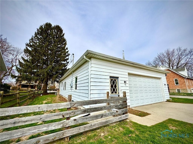 106 Adrian St, Delta, OH 43515 - view of front of property with a detached garage