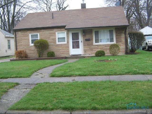 414 Boxhall Rd, Toledo, OH 43612 - single story home featuring stone siding, a chimney, and a front lawn