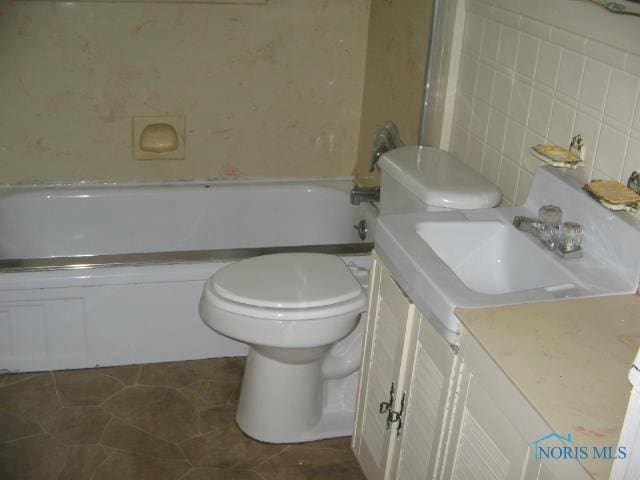 238 E Northgate Pkwy, Toledo, OH 43612 - full bathroom featuring toilet, vanity, tile patterned flooring, and  shower combination