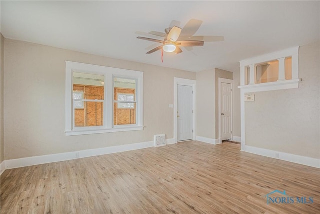 1110 Montrose Ave, Toledo, OH 43607 - unfurnished living room with baseboards, a ceiling fan, and wood finished floors