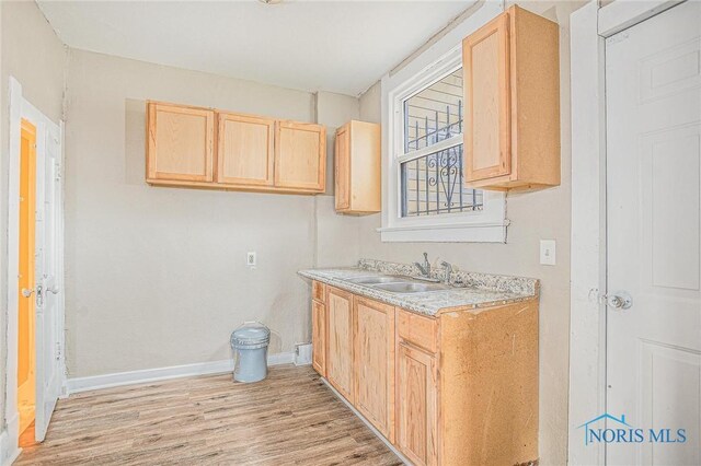 1110 Montrose Ave, Toledo, OH 43607 - bathroom featuring wood finished floors, vanity, and baseboards
