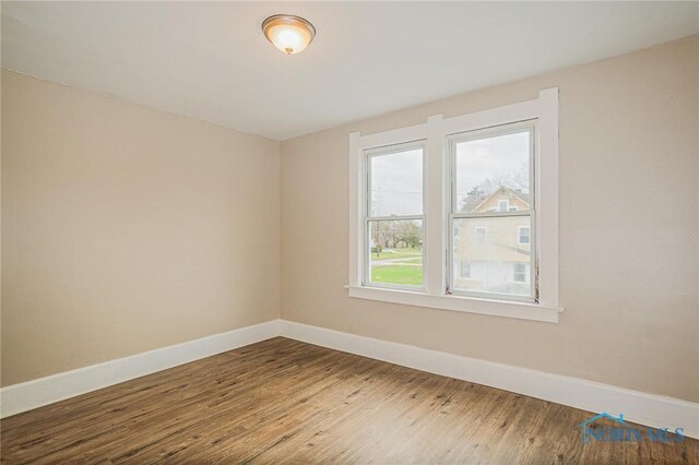 1110 Montrose Ave, Toledo, OH 43607 - empty room with wood finished floors and baseboards