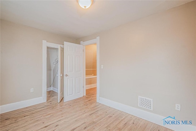 1110 Montrose Ave, Toledo, OH 43607 - empty room featuring visible vents, baseboards, and wood finished floors