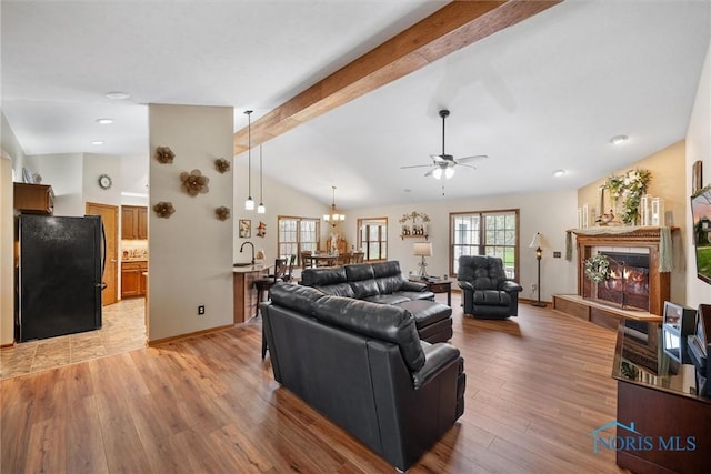 6681 Bellflower Ct, Curtice, OH 43412 - living area with ceiling fan, light wood-type flooring, a lit fireplace, recessed lighting, and baseboards