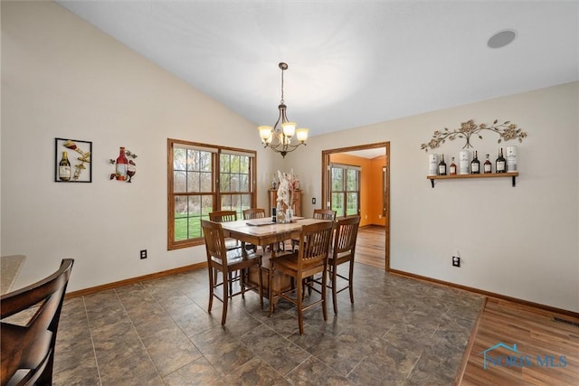 6681 Bellflower Ct, Curtice, OH 43412 - dining area featuring a chandelier, baseboards, and vaulted ceiling