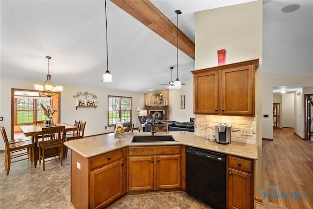 6681 Bellflower Ct, Curtice, OH 43412 - kitchen with dishwasher, a peninsula, a sink, brown cabinetry, and hanging light fixtures