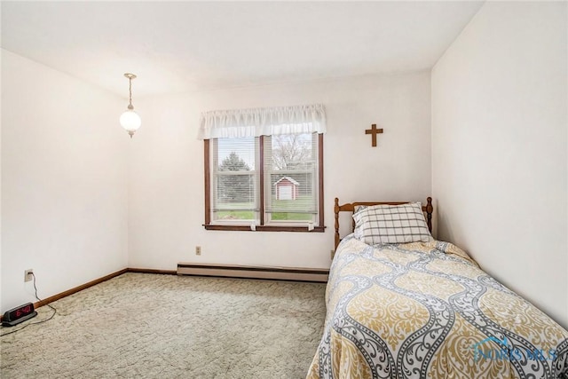 bedroom featuring carpet, baseboard heating, and baseboards