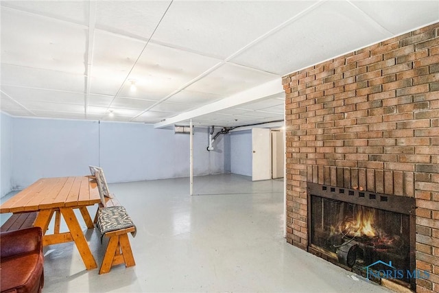 finished basement with a fireplace