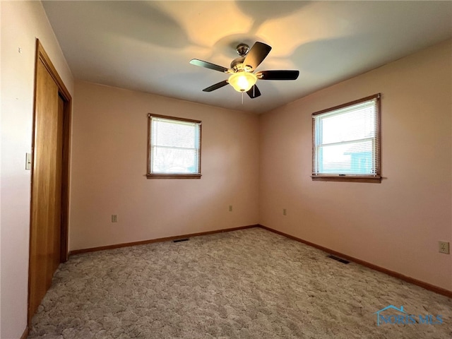 105 W Chris St, Carey, OH 43316 - unfurnished bedroom featuring carpet flooring, ceiling fan, baseboards, visible vents, and a closet