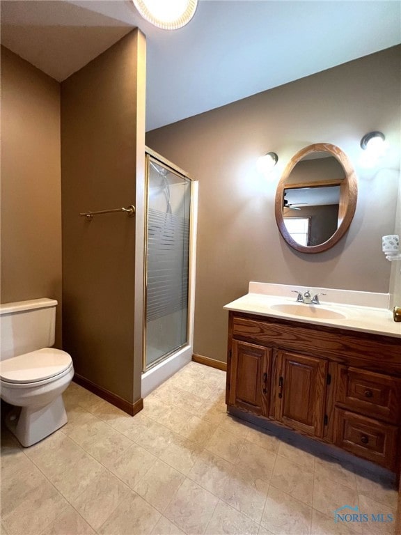 105 W Chris St, Carey, OH 43316 - full bathroom featuring vanity, toilet, baseboards, and a stall shower