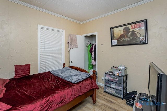 bedroom featuring crown molding and wood finished floors