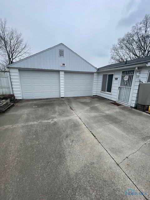 garage featuring driveway