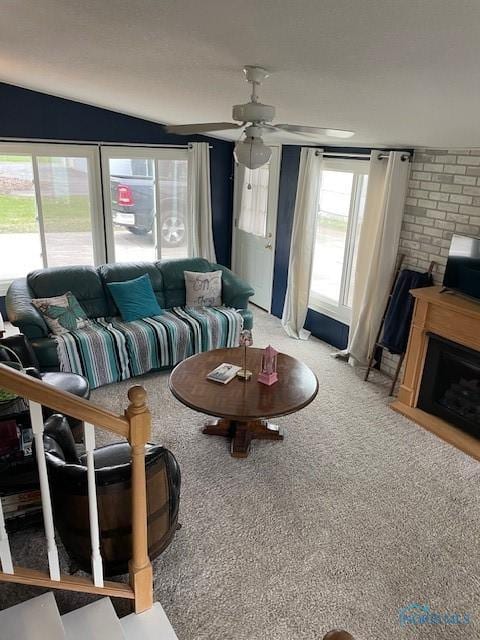 living area with carpet and a ceiling fan