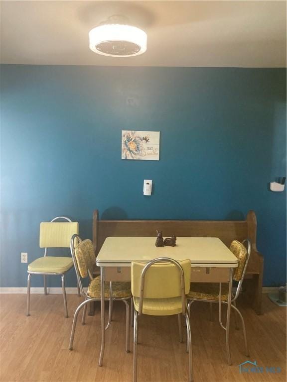 dining room with wood finished floors and baseboards