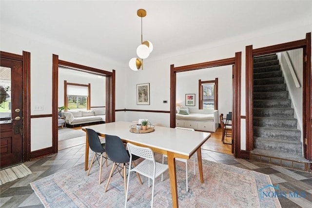 dining area featuring stairway