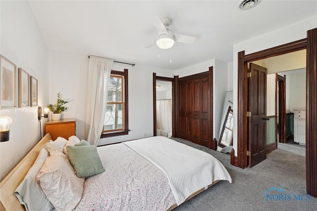 bedroom featuring visible vents, ceiling fan, and carpet floors