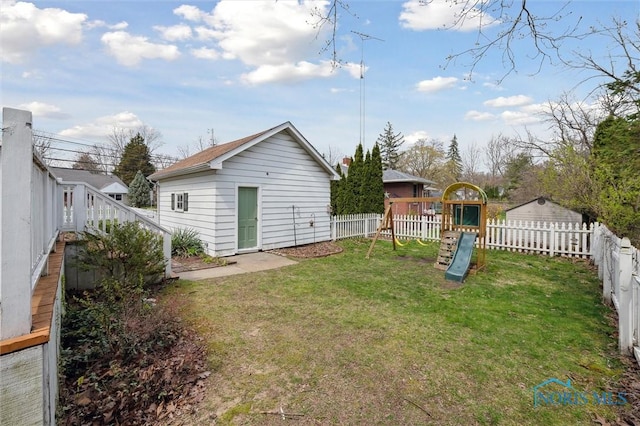 view of yard featuring a fenced backyard and a playground