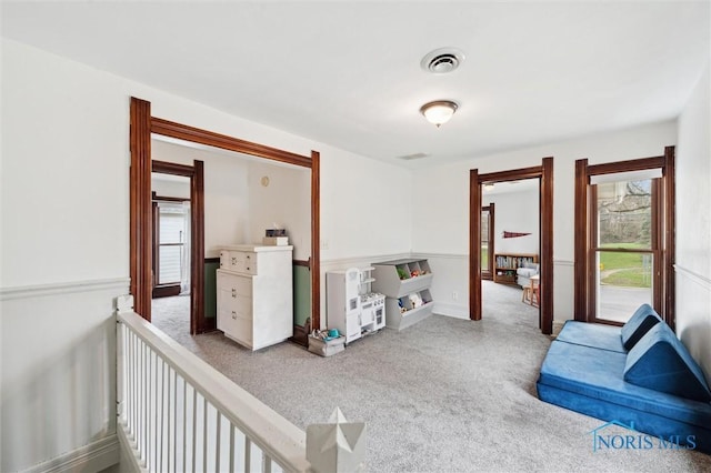 interior space with visible vents and carpet