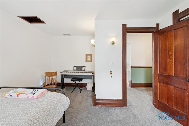 carpeted bedroom featuring visible vents and baseboards