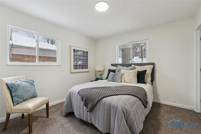 bedroom featuring baseboards and carpet flooring