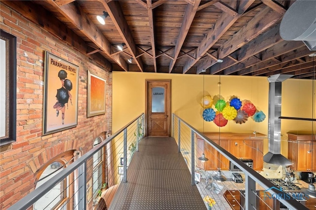 1 S Saint Clair St, Toledo, OH 43604 - hallway featuring brick wall, a sink, wood ceiling, and beamed ceiling