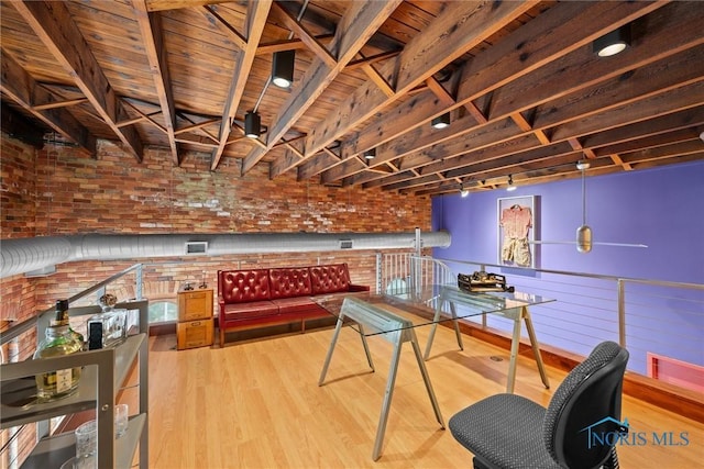 1 S Saint Clair St, Toledo, OH 43604 - recreation room featuring wood finished floors, brick wall, and visible vents