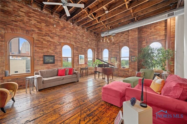 1 S Saint Clair St, Toledo, OH 43604 - living area with brick wall, a high ceiling, and plenty of natural light