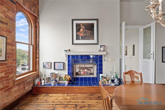 1 S Saint Clair St, Toledo, OH 43604 - living room with brick wall and a tile fireplace