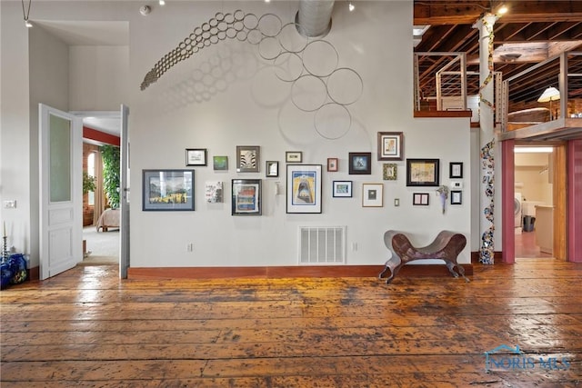 1 S Saint Clair St, Toledo, OH 43604 - sitting room with a high ceiling, visible vents, and hardwood / wood-style flooring